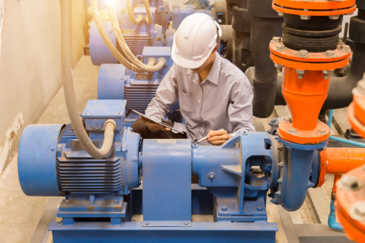 Engineer Maintaining Pump